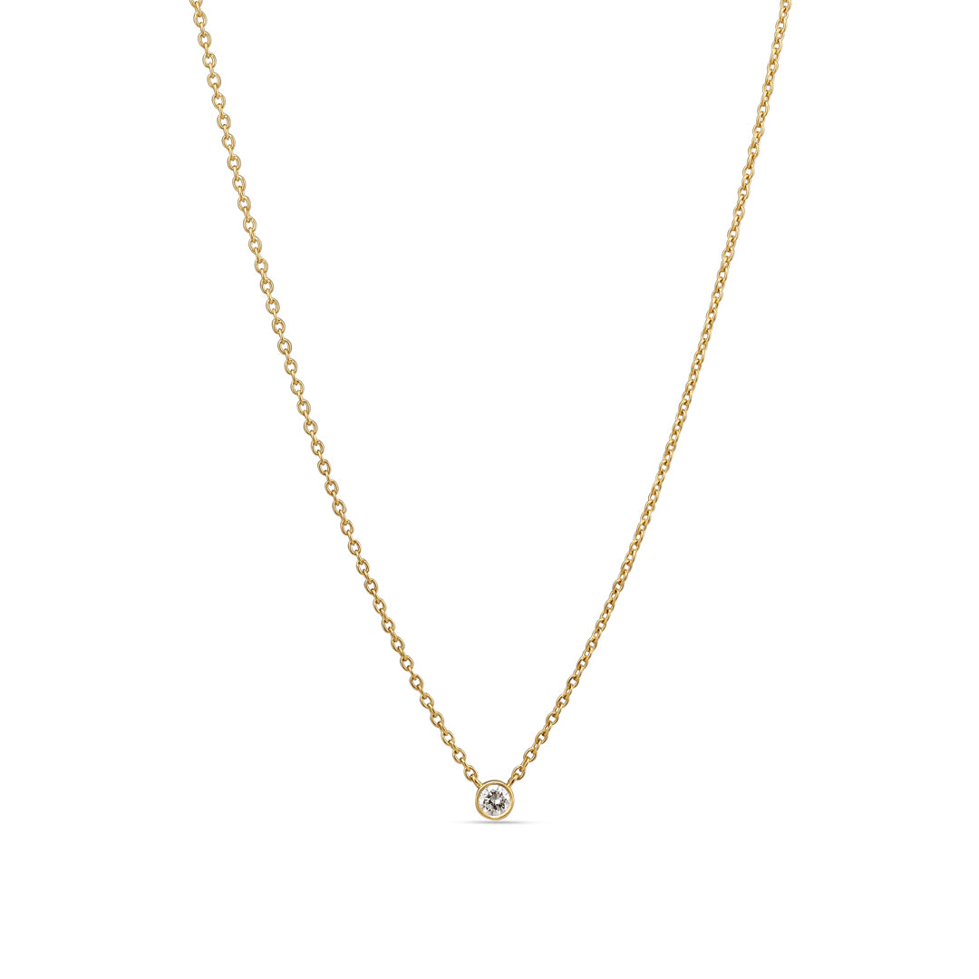 Bezel solitaire halskæde i hvidguld med 0,10 ct.
